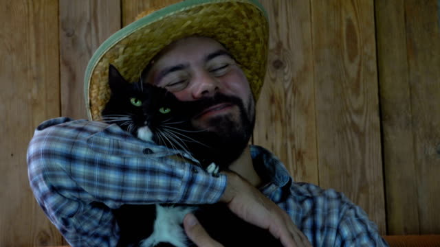 The-unshaven-man-lying-with-a-cat
