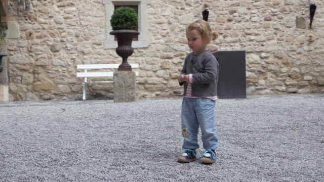Toddler-Running-in-Medieval-Castle-Inner-Courtyard