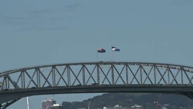 New-Zealand-National-flag-and-the-Silver-Fern-flag-on-Auckland-Harbour-Bridge