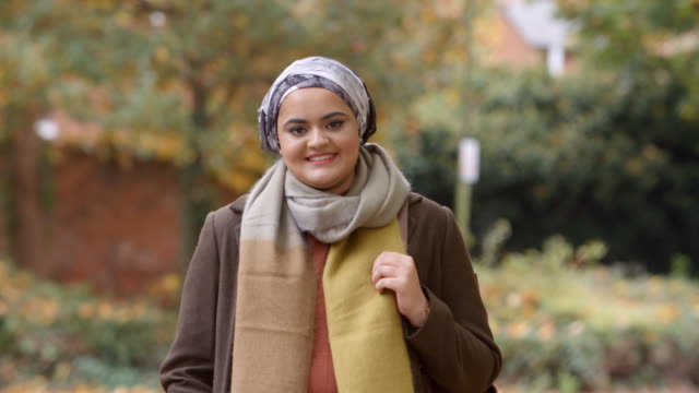 Portrait-Of-British-Muslim-Woman-In-Urban-Park