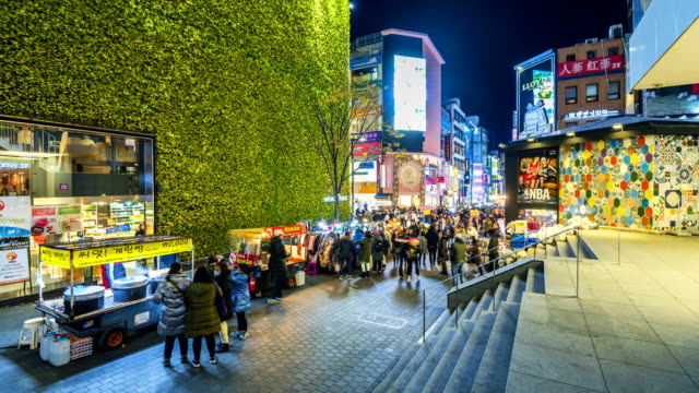 Timelapse-at-Myeong-dong-Market.People-walking-on-a-shopping-street-at-night,-Seoul,-South-Korea