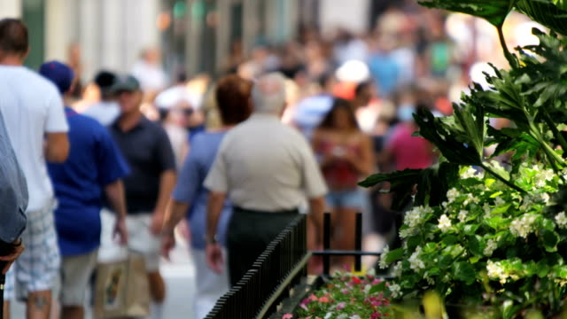 City-population-walking-on-busy-sidewalks-Downtown-Illinois