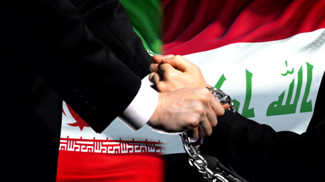 Iran-sanctions-Iraq,-chained-arms,-political-or-economic-conflict,-trade-ban