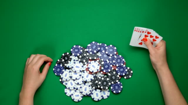 Poker-player-holding-royal-flush,-going-all-in.-Successful-game,-winning