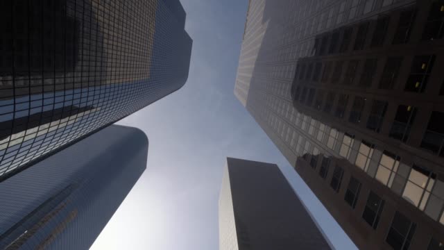 Looking-up-glide-shot-view-of-modern-business-skyscrapers-in-Los-Angeles-city-financial-district