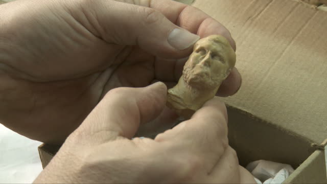figurine-in-hand
