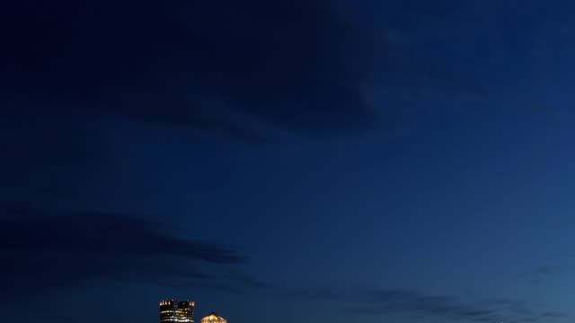 Time-lapse-close-up-tilt-shot-down-Boston-skyline-at-twilight