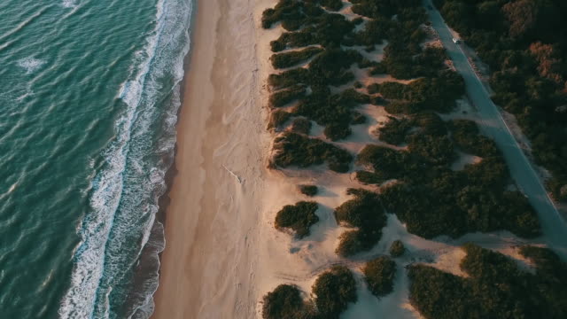 Aerial-video-of-an-Italian-wild-beach-at-sunset