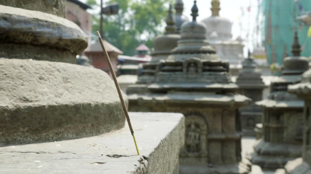 Incense-smoldering-in-ancient-Sawayambhunath-monkey-temple-in-Kathmandu,-Nepal.