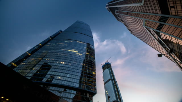 bottom-up-view-of-rotating-skyscrapers-and-flying-clouds,time-lapse,-hyper-lapse