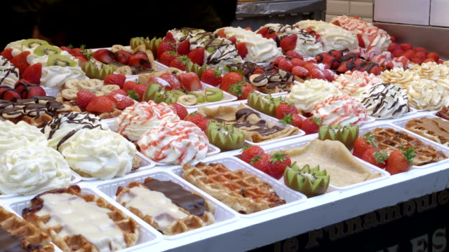 side-view-of-a-variety-of-fresh-belgian-waffles-on-display-in-brussels