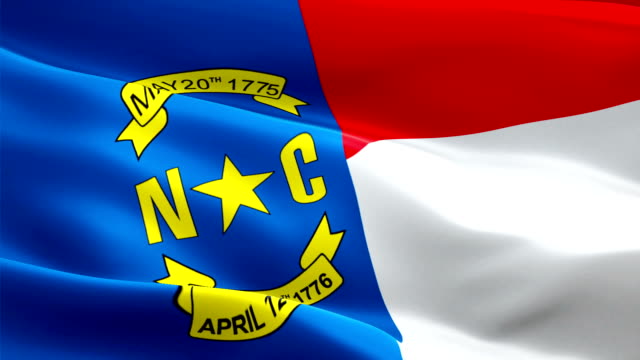 Flag-of-North-Carolina-video-waving-in-wind,-Realistic-US-State-Flag-background
