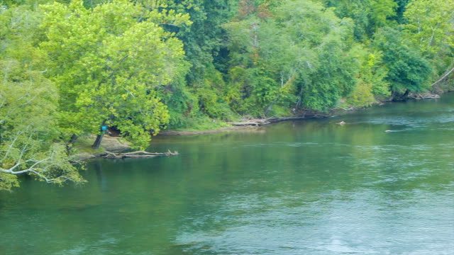 Panning-Across-the-French-Broad-River-in-Asheville,-NC