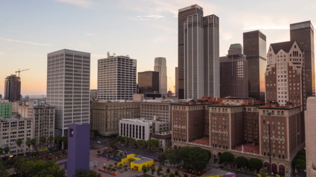 Downtown-Los-Angeles-Skyline-and-Pershing-Square-Day-To-Night-Sunset-Timelapse