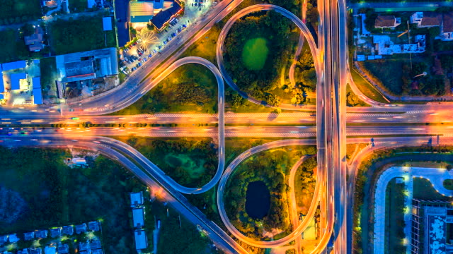 Aerial-view-Top-view-Time-lapse-of-the-expressway,-motorway-and-highway-in-the-detail-of-intersection-at-night