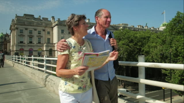 Active-senior-couple-walking-in-london