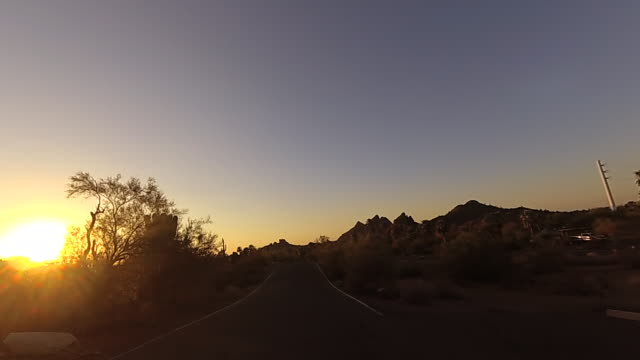 Drive-through-dramatic-Arizona-Papago-Park-Buttes-towards-Phoenix.