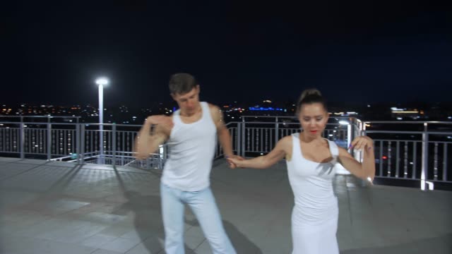 Couple-of-lovers-dancing-in-empty-night-street,-dating-and-love,-seduction