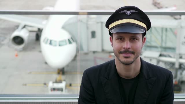 Successful-pilot-on-airport-terrace-before-flying-an-international-airliner