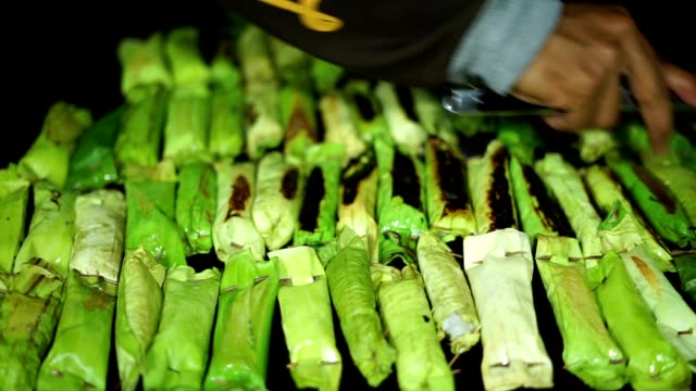 Food-Vendor-grilled-Sticky-Rice-at-Indonesian-Traditional-Cake-bazaar