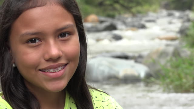 Young-Girl-Smiling-near-River