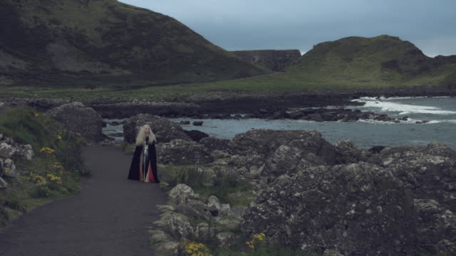 4k-Fantasy-Shot-on-Giant's-Causeway-of-a-Queen-Walking-to-Camera