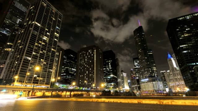 Chicago-Skyscrapers-at-Night-with-Cars-Crossing-the-City