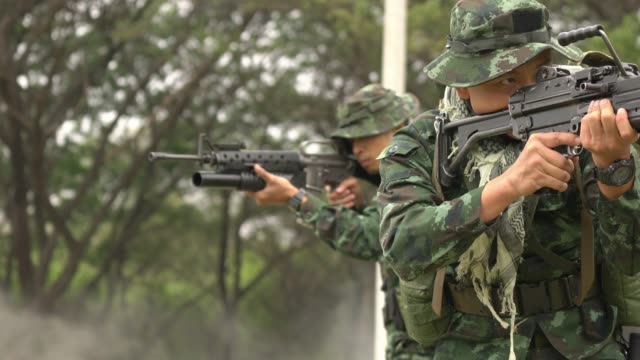 Soldier-holding-gun-weapon-and-waring-armor-uniform.-The-military-is-responsible-for-maintaining-the-territory.