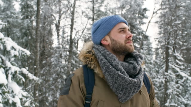 Portrait-of-Happy-Tourist-in-Winter-Forest