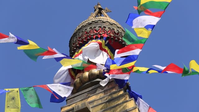 Colorful-flags-flying-from-Buddhist-Stupa-in-Kathmandu-valley,-Nepal