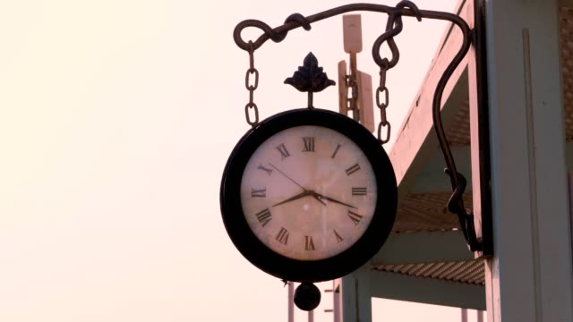 big-street-Round-clock-hanging-on-the-house.-Close-Up