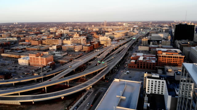 Aerial-view-of-american-city-at-dawn.-High-rise--buildings,-freeway.--Sunny-morning.-Milwaukee,-Wisconsin,-USA