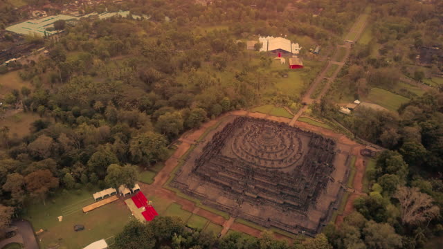 Borobudur-temple-aerial-view-at-sunrise-a-UNESCO-site-and-World-largest-Buddhist-temple,-Indonesia