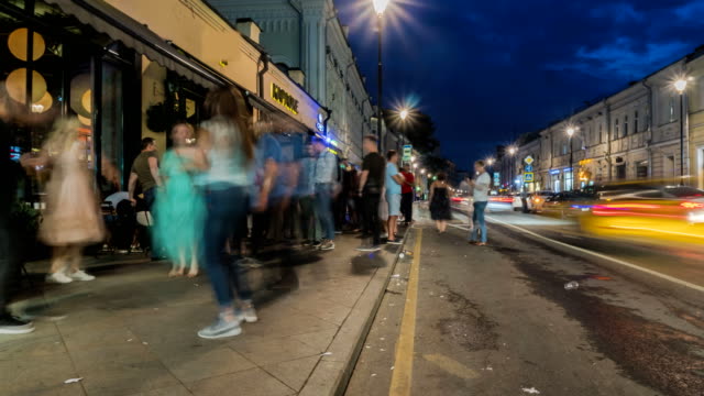 people-have-fun-on-the-city-streets-on-a-summer-evening-on-Saturday,time-lapse