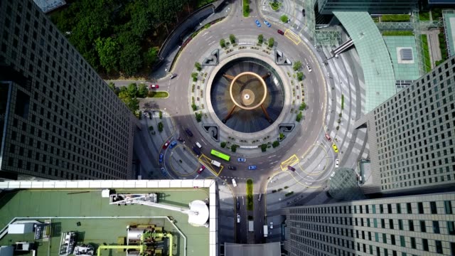 Top-aerial-drone-view-of-traffic-movement-at-Fountain-of-Wealth,-Suntec-City.