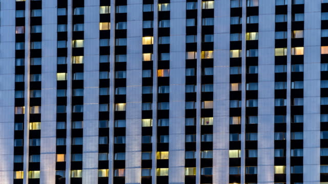 Illuminated-windows-of-hotel-,-time-lapse