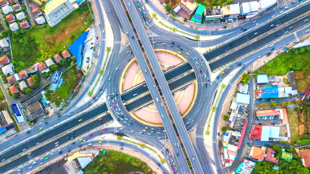 Aerial-view-Time-lapse-traffic-in-expressway,-motorway-and-highway-in-the-detail-of-circus-intersection