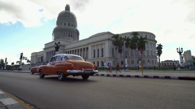 Cuban-Classic-1950's-American-Vintage-Taxi-Car-driving-on-the-street-of-Havana-city,-Cuba