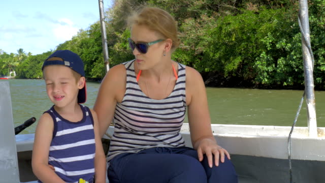 Mother-and-son-having-nature-boat-travel