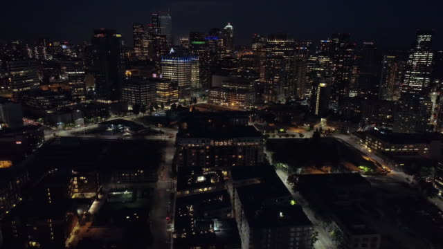 City-Lights-Aerial-of-Downtown-Skyline-Skyscraper-Buildings-Lit-at-Night