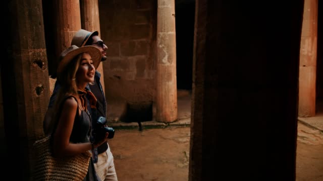 Young-couple-on-summer-vacations-visiting-archaeological-site-in-Rome