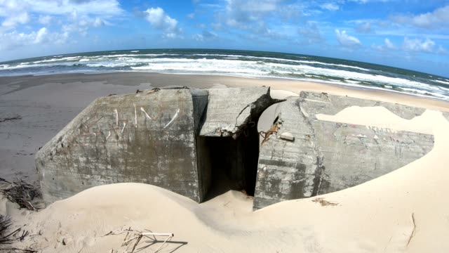 Ruin-of-concrete-Bunker,-Atlantic-Wall,-Second-World-War,-memorial,-North-Sea,-4K