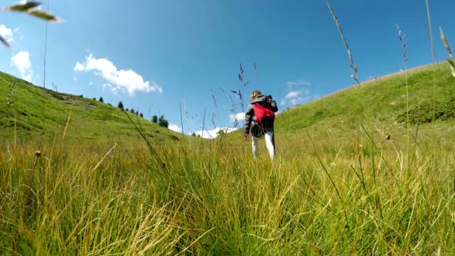 Family-on-a-trekking-day-in-mountain,-video-footage-4K
