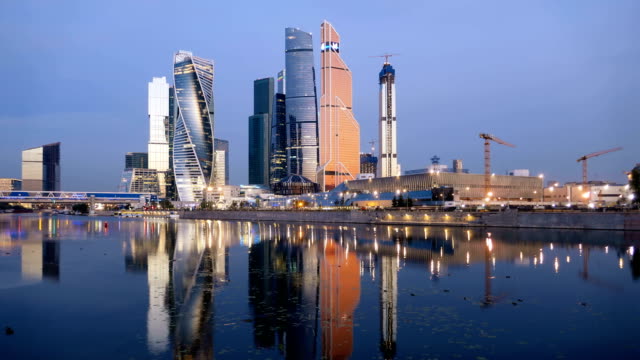 Morning-time-lapse-of-Moscow-City-(Moscow-International-Business-Center)-and-calm-Moskva-river,-Russia.