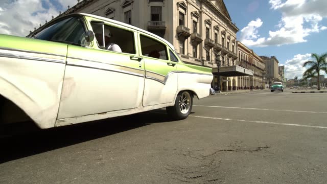 Classic-1950's-American-Vintage-Cuban-Taxi-Car-driving-on-the-street-of-Havana-city,-Cuba.