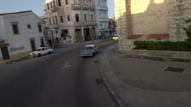 classic-1950's-American-Vintage-Taxi-Car-driving-on-street-old-Havana,-Cuba