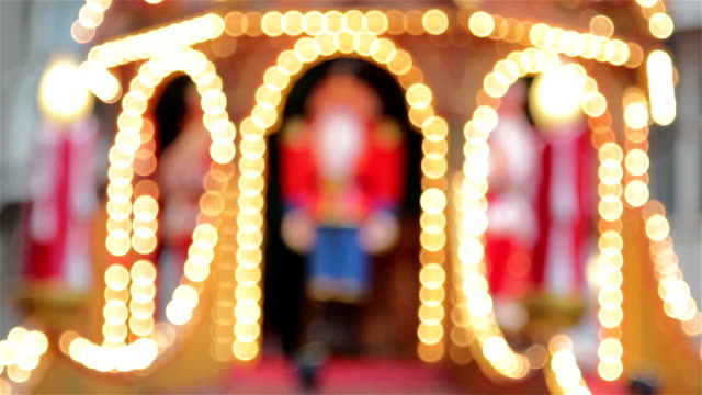 Spinning-Santa-and-Xmas-Lights-Pull-Focus-Atop-German-Christmas-Market-Stall