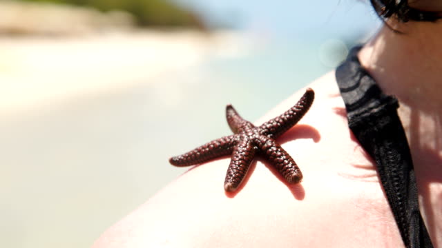woman-with-starfish-on-shoulder