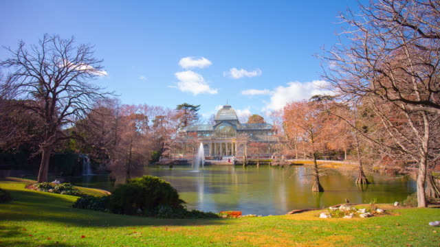 sunny-day-pond-panoramic-view-on-palacio-de-cristal-4k-time-lapse-spain