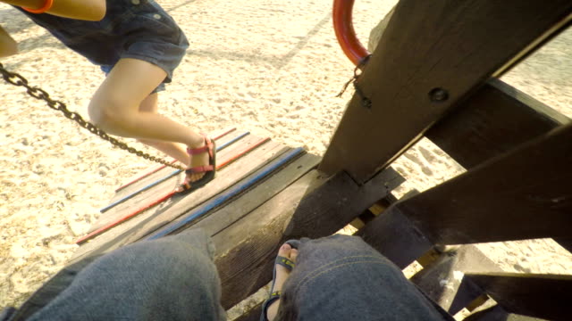 POV-footage-of-three-kids-playing-in-a-playground
